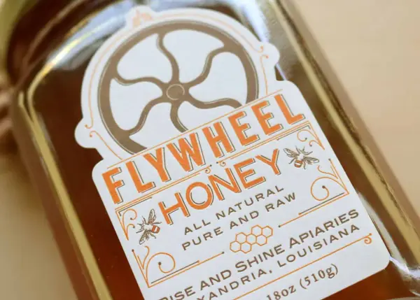 Honey jars showing coordinating top and back letterpress labels