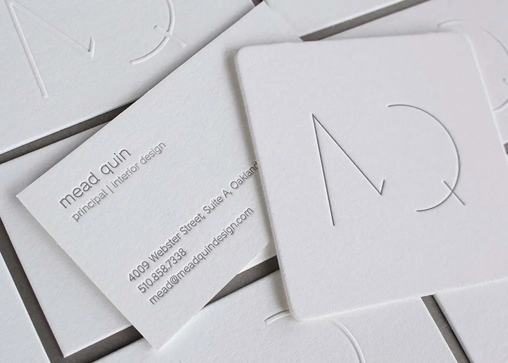 Two-color letterpress printing of minimalist logo on white Crane's Lettra paper