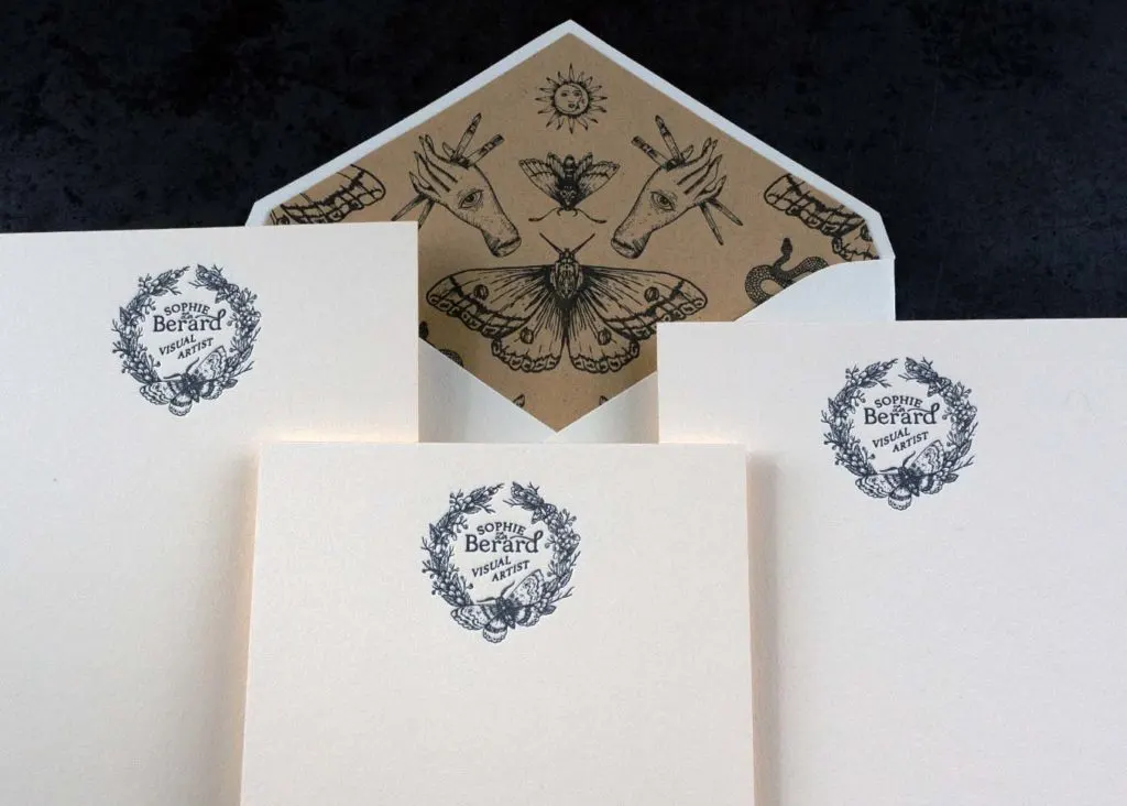 Close-up of gold edge painting on double-thick cotton note card showing painted edges