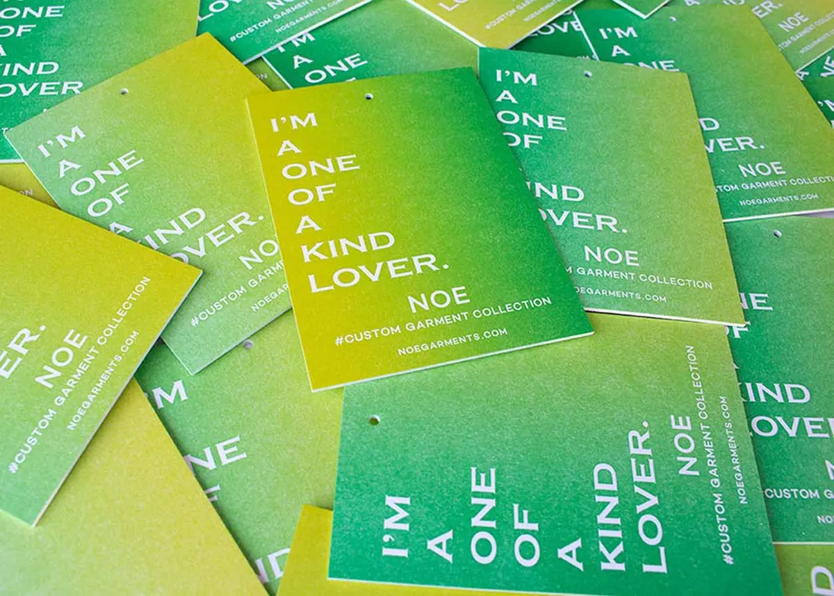 Rainbow roll hang tags with drilled holes and string ready for garment attachment